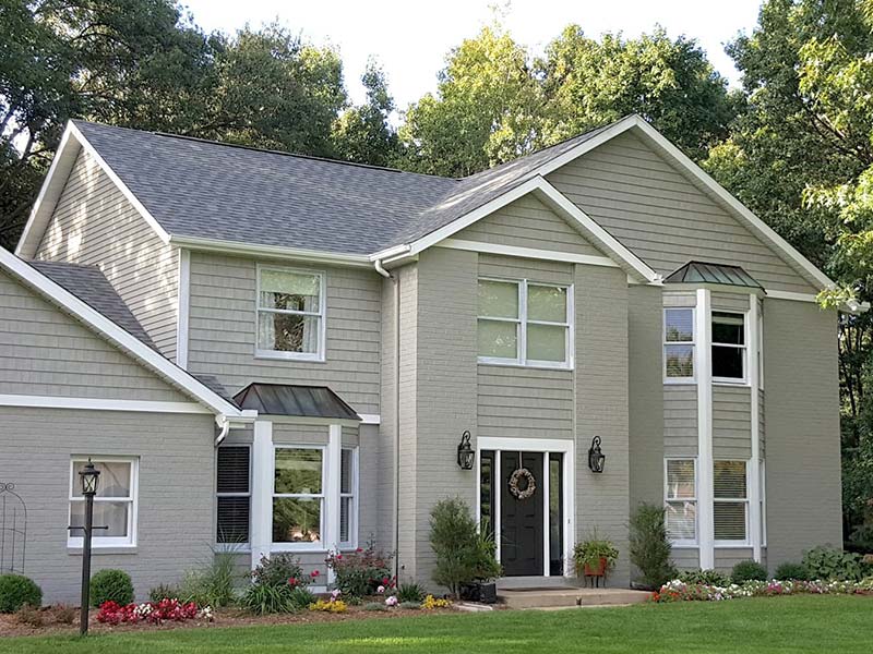 exterior of home painted in light gray